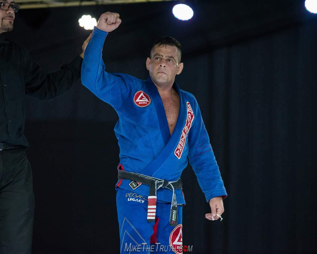 Professor Alejandro Siqueira competing in a Brazilian Jiu-Jitsu tournament match