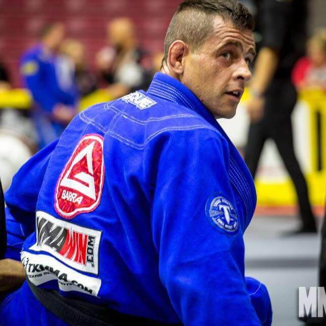 Professor Alejandro Siqueira competing in a Brazilian Jiu-Jitsu tournament match