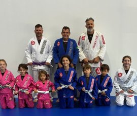 Coach Ryan Kagay and Professor Alejandro Siqueira pictured with kids and adult students after Brazilian Jiu-Jitsu training at Gracie Barra Argyle. Coach Ryan Kagay and Professor Alejandro Siqueira with kids and adult Jiu-Jitsu students at Gracie Barra Argyle in Argyle TX