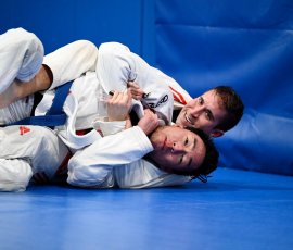 Two men training Brazilian Jiu-Jitsu during adult class at Gracie Barra Argyle in Argyle TX