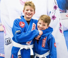 Brothers building skill and confidence through kids' Jiu-Jitsu training. Two brothers training Brazilian Jiu-Jitsu together at Gracie Barra Argyle